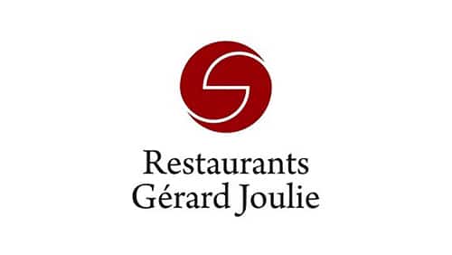 Logo des Restaurants Gérard Joulie représentant un emblème circulaire rouge au-dessus du nom écrit en caractères noirs avec empattement sur fond blanc.
